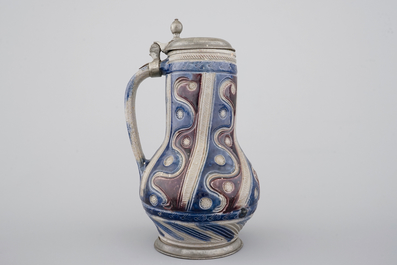 A Westerwald pewter-mounted jug in manganese and blue, 17th C.