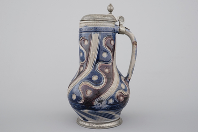 A Westerwald pewter-mounted jug in manganese and blue, 17th C.