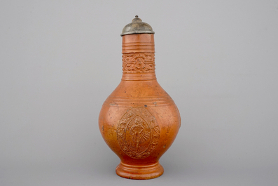 A tall Raeren stoneware jug with the Roman god Mercury, dated 1618