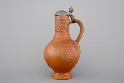 A tall Raeren stoneware jug with the Roman god Mercury, dated 1618