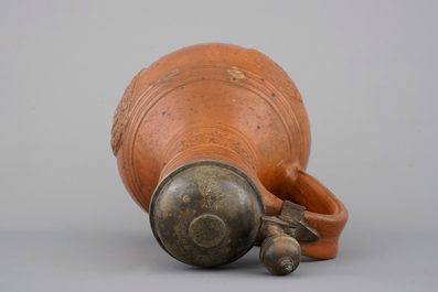 A tall Raeren stoneware jug with the Roman god Mercury, dated 1618