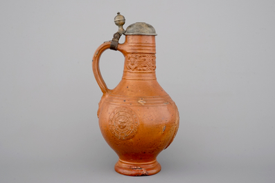 A tall Raeren stoneware jug with the Roman god Mercury, dated 1618