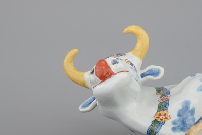 A pair of polychrome Dutch Delft models of cows, 18th C.