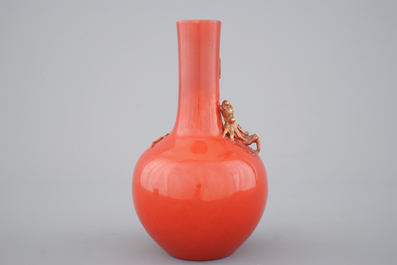 A Chinese porcelain coral red ground dragon vase, 19th C.