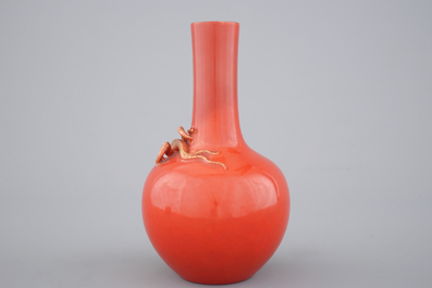 A Chinese porcelain coral red ground dragon vase, 19th C.