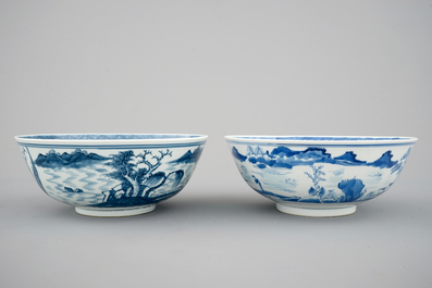 A pair of Chinese blue and white bowls decorated with landscapes, 19th C