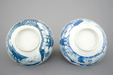 A pair of Chinese blue and white bowls decorated with landscapes, 19th C
