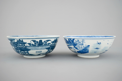 A pair of Chinese blue and white bowls decorated with landscapes, 19th C