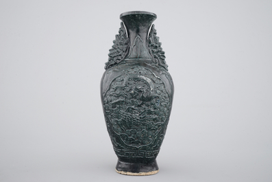 A Chinese black glazed relief-moulded vase, 19/20th C.