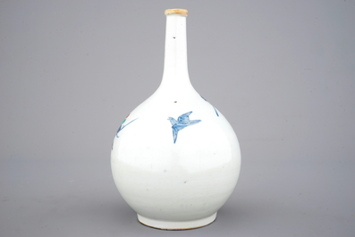 A Japanese bottle vase with polychrome floral decoration, 17/18th C.