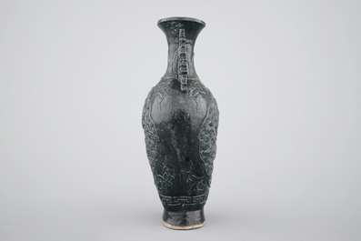 A Chinese black glazed relief-moulded vase, 19/20th C.