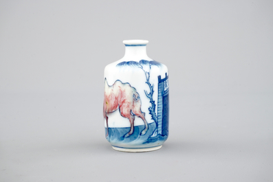 A Chinese blue and underglaze red porcelain snuff bottle with a camel, 18/19th C.