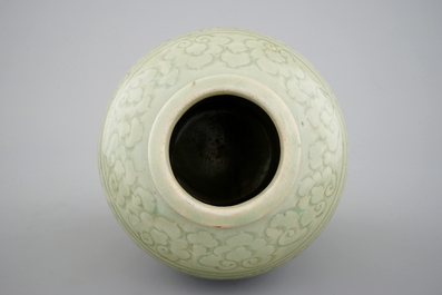 A Chinese porcelain incised celadon vase, Ming Dynasty