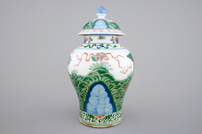 A Chinese wucai porcelain baluster vase with cover, 19th C.