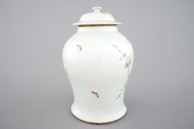 A Chinese famille rose vase and cover with birds on a branch, 19th C.