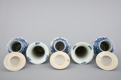 A Chinese bleu de Hue porcelain five piece garniture with acrobats 