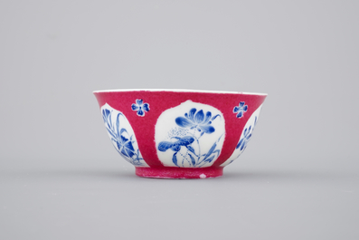 An unusual Chinese ruby ground and overglaze blue cup and saucer, Yongzheng, 1722-1735