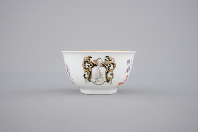 A fine Chinese armorial cup and two saucers, Qianlong, 18th C.