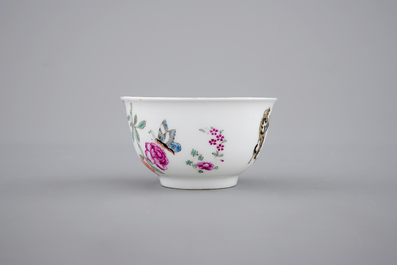 A fine Chinese armorial cup and two saucers, Qianlong, 18th C.