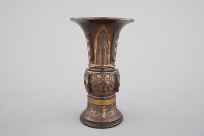 A Chinese archaistic bronze parcel-gilt gu beaker vase, 17/18th C