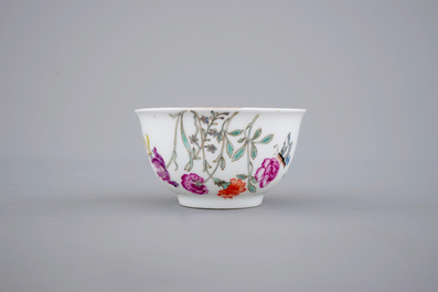 A fine Chinese armorial cup and two saucers, Qianlong, 18th C.