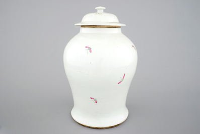 A Chinese famille rose vase and cover with birds on a branch, 19th C.