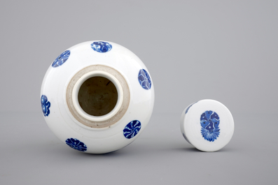 A Chinese blue and white globular jar with cover on a wooden stand, early 19th C.