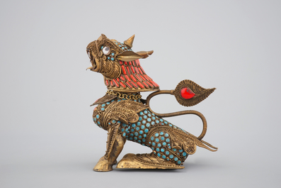 A Chinese or Sino-Tibetan filigree brass, turquoise and coral incense burner in the shape of a foo dog, 20th C.