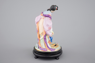 A fine Chinese porcelain figural group on a wooden stand, 20th C