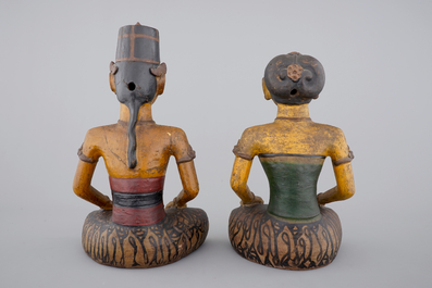 Two tall Indonesian cold-painted pottery figures of servants, 19th C.
