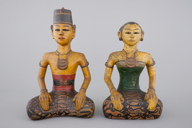 Two tall Indonesian cold-painted pottery figures of servants, 19th C.