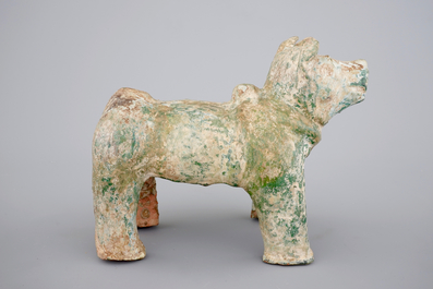 A Chinese green glazed pottery figure of a dog, presumably Han Dynasty