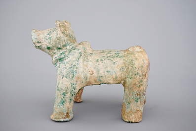 A Chinese green glazed pottery figure of a dog, presumably Han Dynasty
