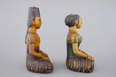 Two tall Indonesian cold-painted pottery figures of servants, 19th C.