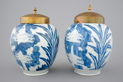 A pair of blue and white Japanese porcelain vases with brass covers in Chinese transitional style, Edo, 17th C.
