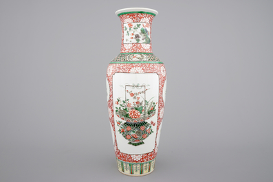 A fine Chinese famille verte and iron red porcelain vase with flowers in a basket, 19th C.