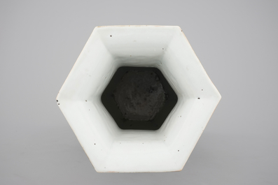 A Chinese hexagonal relief-decorated famille rose porcelain vase, 19th C.