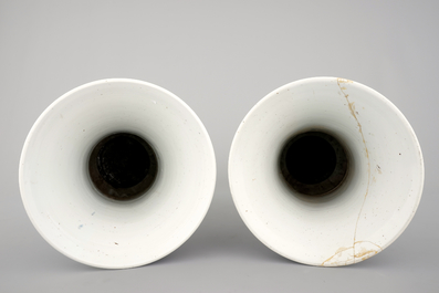An unusual pair of tall Chinese blue and white porcelain gu-shaped vases, Kangxi, ca. 1700