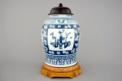 A tall Chinese blue and white porcelain temple jar on gilt wood stand, 19th C.
