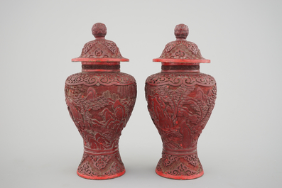A pair of Chinese carved cinnabar lacquer vases and covers, 18/19th C