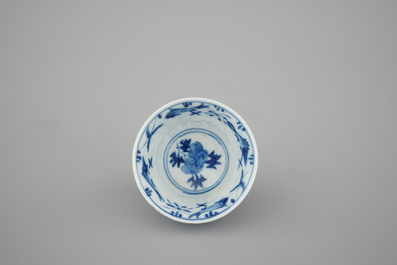 A set of six Chinese blue and white cups and saucers with fish, 19th C.