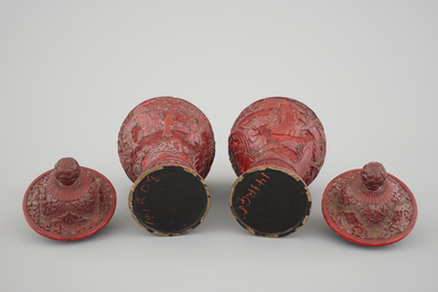 A pair of Chinese carved cinnabar lacquer vases and covers, 18/19th C