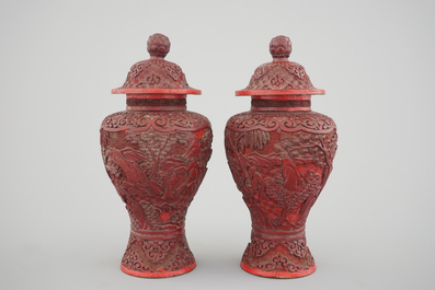 A pair of Chinese carved cinnabar lacquer vases and covers, 18/19th C