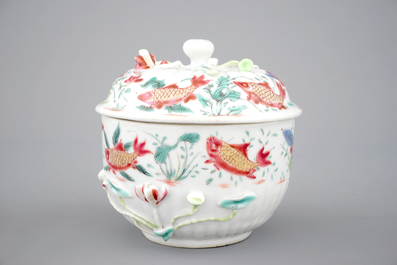 A Chinese famille rose and relief box and cover and two saucers with fish, Yongzheng, 1722-1735