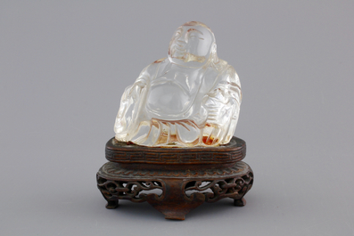 A Chinese rock crystal Buddha on stand, 18/19th C.
