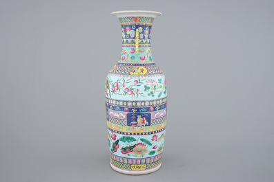 A tall Chinese famille rose vase with birds among flowers between colored bands of symbolim, 19th C.