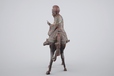 A Japanese champlev&eacute; enamel and bronze figure of a sage riding a donkey, 19th C.