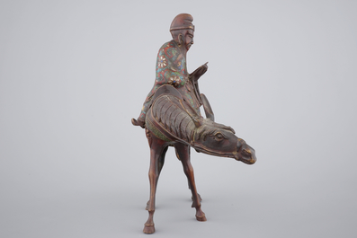 A Japanese champlev&eacute; enamel and bronze figure of a sage riding a donkey, 19th C.