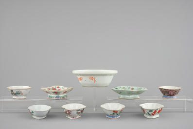 A Chinese famille rose basin with a bird on a branch and 8 smaller bowls, 19th C.