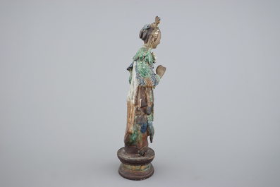 A tall Chinese sancai pottery figure of a guanyin, 18/19th C.